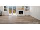 Living room featuring a fireplace and sliding glass doors leading to an outdoor deck at 10720 Forest Dr, Matthews, NC 28105