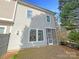 Exterior of the home's backyard featuring a screened-in porch at 11005 Cobb Creek Ct, Charlotte, NC 28277