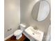 Bathroom featuring a pedestal sink, modern fixtures, and a clean design at 11005 Cobb Creek Ct, Charlotte, NC 28277