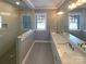 Modern bathroom featuring a glass-enclosed shower and a double vanity with stunning white countertops at 11005 Cobb Creek Ct, Charlotte, NC 28277