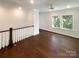 Spacious bonus room with hardwood floors and large windows providing natural light at 11005 Cobb Creek Ct, Charlotte, NC 28277