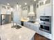 Gourmet kitchen with stainless steel appliances, a large island and pendant lighting at 11005 Cobb Creek Ct, Charlotte, NC 28277