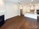 Spacious and airy living room with hardwood floors and a cozy fireplace at 11005 Cobb Creek Ct, Charlotte, NC 28277
