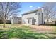 View of the home's backyard, showing a shed, patio, and lawn at 11132 White Stag Dr, Charlotte, NC 28269
