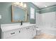 Bathroom with white vanity, mirror, and tub and shower combination at 11132 White Stag Dr, Charlotte, NC 28269