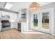 Clean kitchen with white cabinets, stainless steel appliances, and a bright breakfast nook at 11132 White Stag Dr, Charlotte, NC 28269
