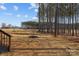 Large backyard with longleaf pine trees lining the back of the property at 119 Mills Garden Rd, Statesville, NC 28625