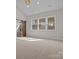 Bright, spacious bedroom with large windows, natural light, and a sliding barn door to the bathroom at 119 Mills Garden Rd, Statesville, NC 28625