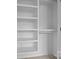 Spacious walk-in closet with white shelving, offering ample storage and organization space at 119 Mills Garden Rd, Statesville, NC 28625