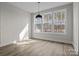Bright dining area with ample windows offering verdant view and modern pendant lighting at 119 Mills Garden Rd, Statesville, NC 28625
