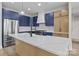 Bright kitchen featuring a large island, stainless steel appliances, and pendant lighting at 119 Mills Garden Rd, Statesville, NC 28625