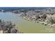 Aerial view showcasing waterfront property with private docks on a picturesque lake at 126 Anchor Ln, Troutman, NC 28166