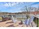 Spacious deck overlooking the lake, complete with comfortable seating for outdoor relaxation and entertaining at 126 Anchor Ln, Troutman, NC 28166