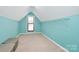 Turquoise bedroom with shelving and a window at 126 Anchor Ln, Troutman, NC 28166