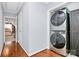 Hallway with a stacked washer and dryer set, and doorway leading to the bedroom at 126 Anchor Ln, Troutman, NC 28166