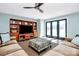 Comfortable living room featuring a built-in entertainment center and access to the outdoors through glass doors at 126 Anchor Ln, Troutman, NC 28166