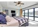 Main bedroom with tray ceilings, a large window with lake views, and an ensuite bathroom at 126 Anchor Ln, Troutman, NC 28166