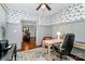 Inviting home office featuring a ceiling fan, hardwood floors, cozy furniture and decorative wallpaper at 126 Anchor Ln, Troutman, NC 28166