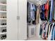Well-organized walk-in closet with built-in shelving and ample hanging space for clothes and accessories at 126 Anchor Ln, Troutman, NC 28166