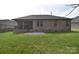 Well-maintained backyard featuring a patio and partial view of a brick home with covered porch at 12889 Hill Pine Rd, Midland, NC 28107