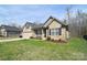 Inviting exterior view of a brick home with a manicured lawn and cozy front porch at 12889 Hill Pine Rd, Midland, NC 28107