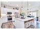 Modern kitchen with white cabinets, stainless steel appliances, and a spacious center island at 12889 Hill Pine Rd, Midland, NC 28107