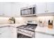 Close-up of a well-equipped kitchen area, showcasing modern appliances and granite countertops at 12889 Hill Pine Rd, Midland, NC 28107