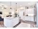 Open concept kitchen with an island, flowing into a living area, and stainless steel appliances at 12889 Hill Pine Rd, Midland, NC 28107