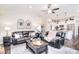 A bright and airy living room featuring a modern design, fireplace, stylish decor, and an open connection to the kitchen at 12889 Hill Pine Rd, Midland, NC 28107