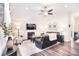 Comfortable living room with a fireplace, vaulted ceiling, fan, and stylish decor, creating a relaxing atmosphere at 12889 Hill Pine Rd, Midland, NC 28107