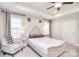 Tranquil main bedroom with tray ceiling, neutral colors, a ceiling fan, and cozy furnishings, promoting relaxation at 12889 Hill Pine Rd, Midland, NC 28107