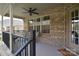 Covered brick patio featuring comfortable seating and an outdoor ceiling fan at 12889 Hill Pine Rd, Midland, NC 28107