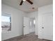 Bright bedroom with hardwood floors, a ceiling fan, white walls, and a window overlooking the porch at 1411 Roseland Dr, Lincolnton, NC 28092