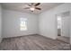 Bright bedroom featuring wood-look floors, a ceiling fan, and attached bathroom at 1411 Roseland Dr, Lincolnton, NC 28092