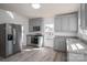 Eat-in kitchen featuring stainless steel appliances, gray cabinets, granite countertops, and vinyl floor at 1411 Roseland Dr, Lincolnton, NC 28092