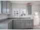 Eat-in kitchen featuring stainless steel appliances, gray cabinets, granite countertops, and vinyl floor at 1411 Roseland Dr, Lincolnton, NC 28092