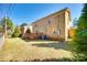Backyard with a brick house, wood deck, and chain link fence at 1438 Plumstead Rd, Charlotte, NC 28216
