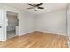 Hardwood flooring and light-colored walls add charm to this living area at 1438 Plumstead Rd, Charlotte, NC 28216