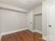 This room features hardwood floors, neutral paint and a single-door closet at 1438 Plumstead Rd, Charlotte, NC 28216