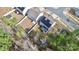 This aerial view showcases a home with solar panels and a fenced backyard in a residential neighborhood at 16138 Aryshire Green Ct, Charlotte, NC 28273