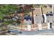 Aerial view of the property showcasing mature trees, solar panels, and a spacious, well-maintained backyard at 16138 Aryshire Green Ct, Charlotte, NC 28273