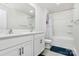 This bathroom has dual sinks, a large mirror, a shower tub and a toilet at 16138 Aryshire Green Ct, Charlotte, NC 28273