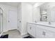 This bathroom has dual sinks, a large mirror, a shower and a door to the toilet room at 16138 Aryshire Green Ct, Charlotte, NC 28273