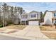 Charming two-story home featuring stone accents, neutral siding, and a two-car garage at 16138 Aryshire Green Ct, Charlotte, NC 28273