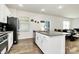 Kitchen island featuring granite countertop, stainless steel appliances, and a breakfast nook at 16138 Aryshire Green Ct, Charlotte, NC 28273