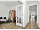 Bright office space with hardwood floors, a glass paneled door and plenty of natural light at 16138 Aryshire Green Ct, Charlotte, NC 28273