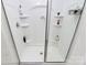 This is an alcove shower with glass doors, shelves, and stainless steel fixtures at 16138 Aryshire Green Ct, Charlotte, NC 28273