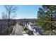 Picturesque aerial shot of a tree-lined street with well-maintained homes and a city skyline at 1738 Matheson Ave, Charlotte, NC 28205