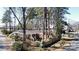 A charming brick home with a fenced yard, mature trees, and a well-maintained exterior at 1738 Matheson Ave, Charlotte, NC 28205