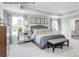 Serene main bedroom featuring tray ceilings, soft lighting, and an en-suite bathroom with a soaking tub at 1805 Ab Moore Jr Dr # 3237, Indian Trail, NC 28079